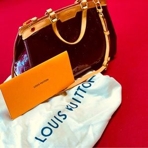 Louis Vuitton hand bag; limited special edition. Hand stitched, maroon leather.